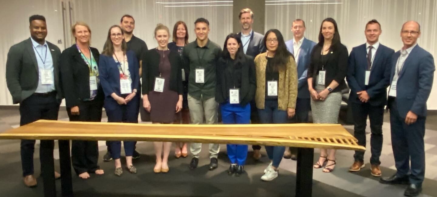 Large group of people standing in a row