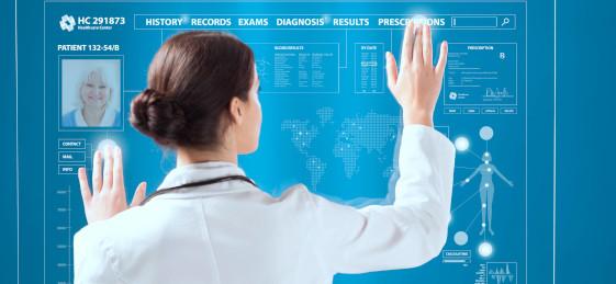 Woman doctor standing in front of a digital screen